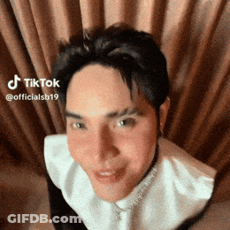 Man Making Funny Face In Front Of Curtain TikTok GIF
