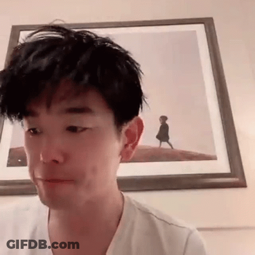 Man Making Funny Face In Front Of Framed Picture GIF