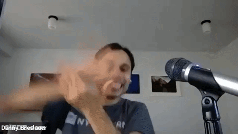 Man Making Funny Face In Front Of Microphone GIF