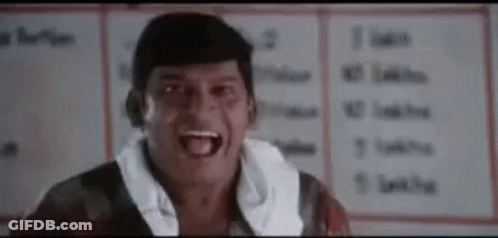Man Making Funny Face In Front Of White Board GIF
