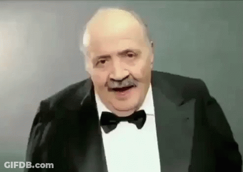 Man Making Funny Face In Suit Bow Tie GIF