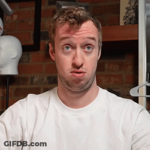 Man Making Funny Face In White Shirt GIF