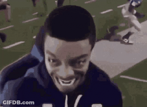 Man Making Funny Face On Chair In Football Field GIF
