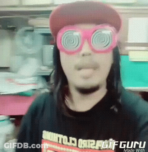 Man Making Funny Face Red Hat Pink Glasses GIF
