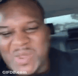 Man Making Funny Face Sitting In Car GIF