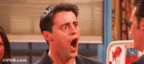 Man Making Funny Face Talking To Another Man GIF