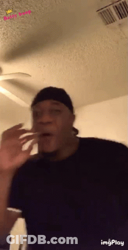 Man Making Funny Face With Ceiling Fan GIF