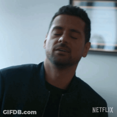 Man Making Funny Face With Eyes Closed In Mirror GIF