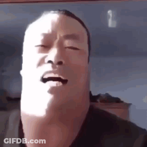 Man Making Funny Face With Eyes Closed In Sun GIF