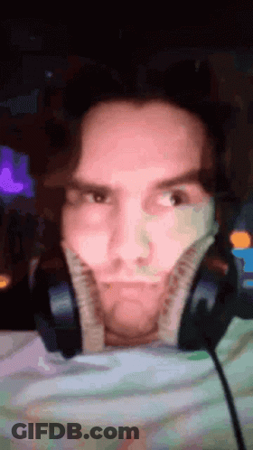 Man Making Funny Face With Headphones GIF