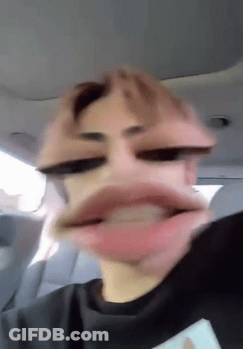 Man Making Funny Face With Mouth Open In Car GIF