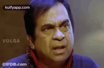 Man Making Funny Face With Scarf GIF