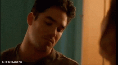 Man Making Funny Face With Woman GIF