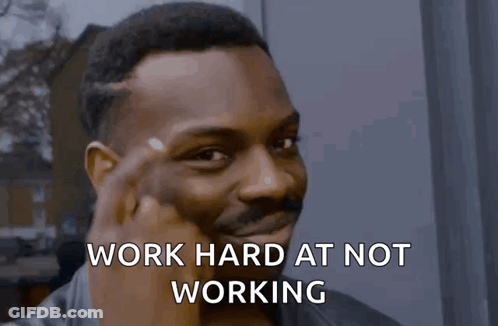 Man Making Funny Face Work Hard At Not Working GIF