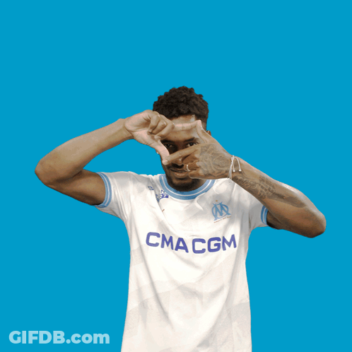 Man Making Heart Shape Wearing Macm Shirt GIF