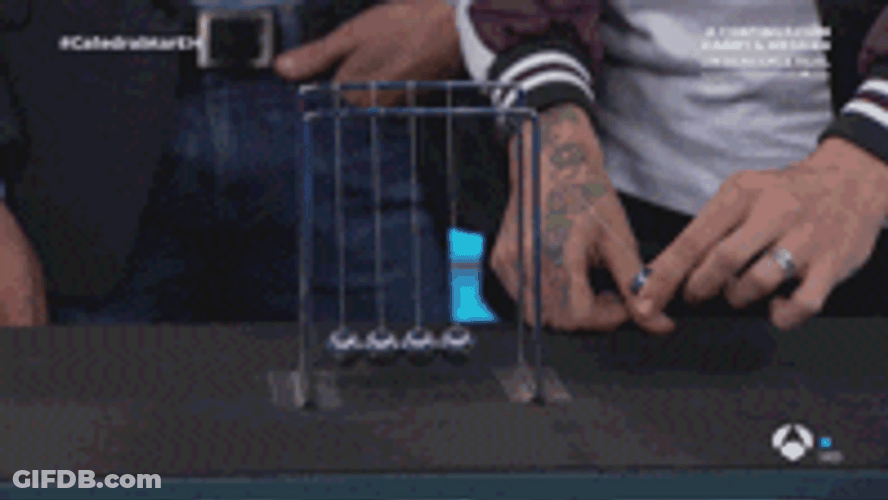 Man Making Newton Pendulum Move GIF