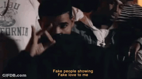 Man Making Peace Sign In Front Of Crowd GIF