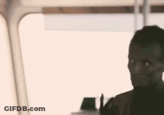 Man Making Peace Sign Sitting On Train GIF