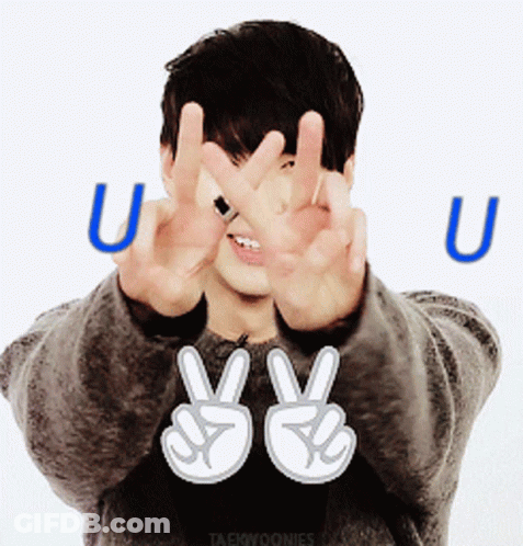 Man Making Peace Sign With Letter U Behind GIF