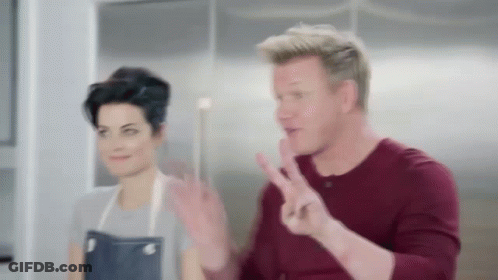 Man Making Peace Sign With Woman GIF