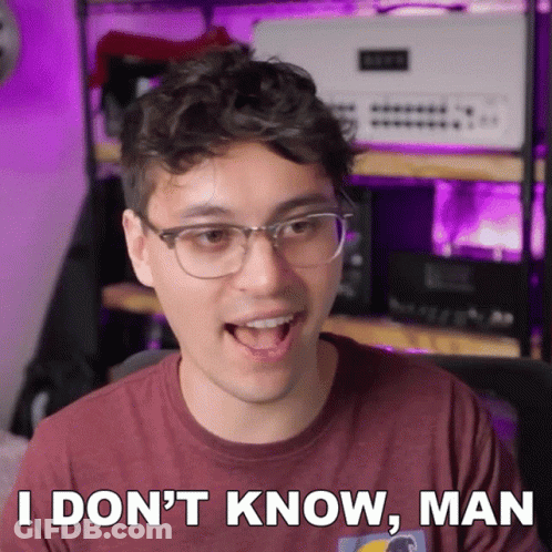 Man Maroon Shirt Glasses Saying I Don't Know GIF