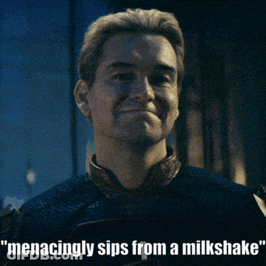Man Menacingly Sips From A Milkshake GIF
