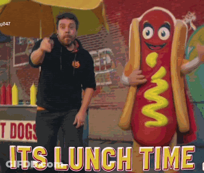 Man Next To Hot Dog Mascot Saying Its Lunch Time GIF