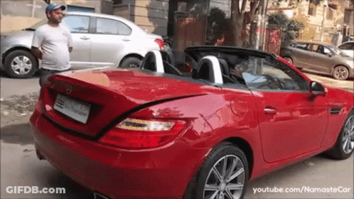 Man Next To Red Mercedes Convertible GIF