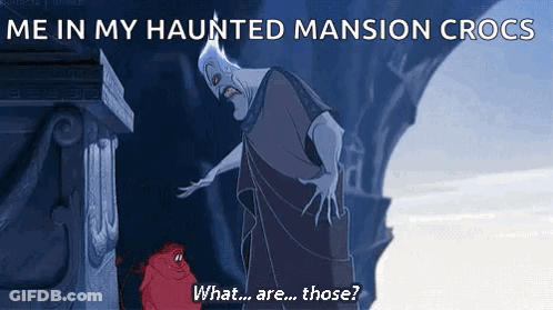 Man Next To Statue Saying Me In My Haunted Mansion Crocs GIF