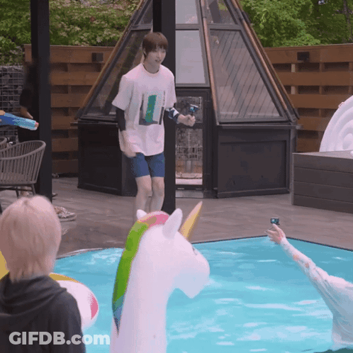 Man Next To Unicorn Inflatable GIF