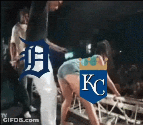 Man Next To Woman With KC Logo Shirt GIF