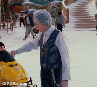 Man Next To Yellow Snowmobile With Star GIF