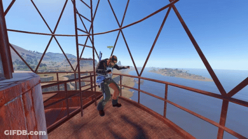 Man On Balcony Overlooking Ocean GIF