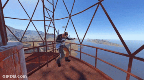 Man On Balcony Overlooking Ocean GIF