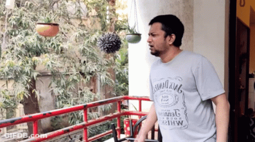 Man On Balcony Wearing Hawaii King T-Shirt GIF