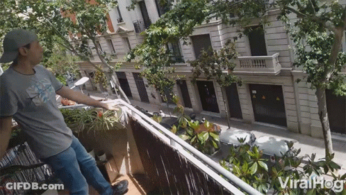Man On Balcony With ViralHog Logo GIF