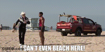 Man On Beach Next To Lifeguard And Truck GIF