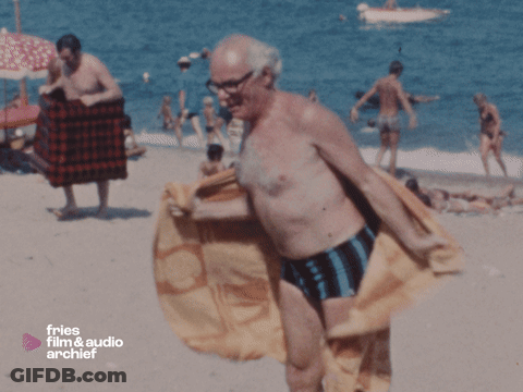 Man On Beach With Fries Film & Audio Archief GIF