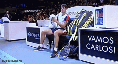 Man On Bench Beside Babolat Bag GIF