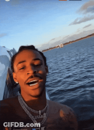 Man On Boat With Darreal Bill Necklace GIF