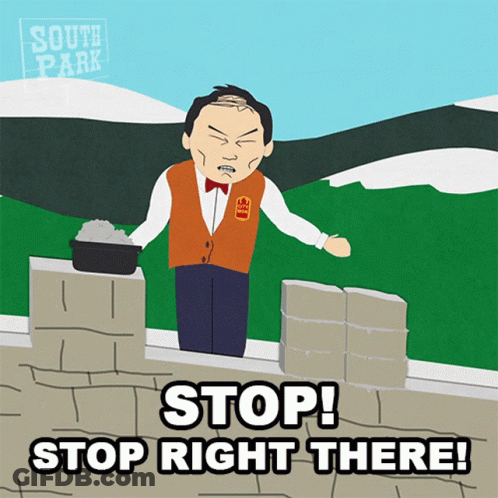Man On Brick Wall Saying Stop Right There GIF