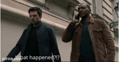Man On Cell Phone While Another Says What Happened GIF
