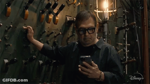 Man On Cell Phone With Disney+ GIF