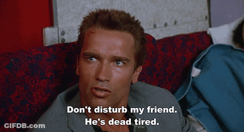 Man On Couch Don't Disturb My Friend He's Dead Tired GIF