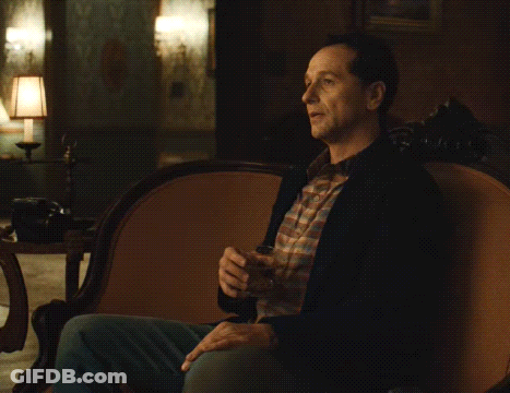 Man On Couch Holding Glass Saying Yeees GIF