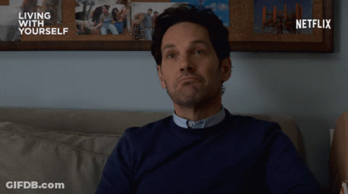 Man On Couch In Front Of Netflix Ad GIF