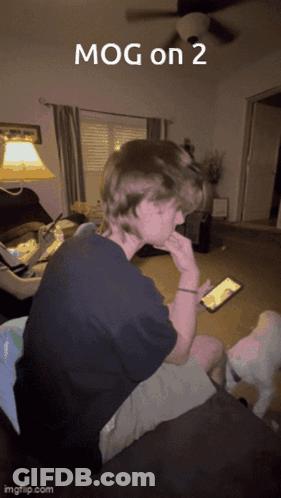Man On Couch Looking At Cell Phone Mog On 2 GIF
