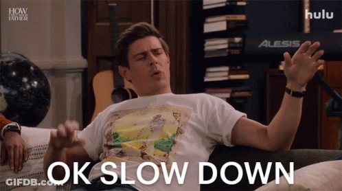 Man On Couch Saying Ok Slow Down GIF