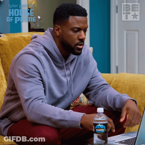 Man On Couch Using Laptop With Bottle Of Mountain Dew GIF