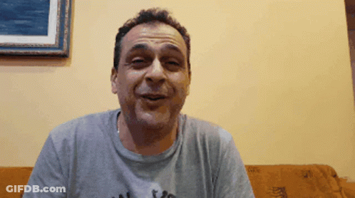 Man On Couch Wearing I Love You Grey Shirt GIF